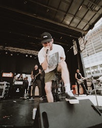 a man on stage performing on a stage