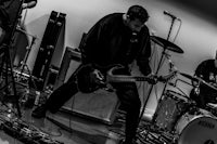 a black and white photo of a band playing music