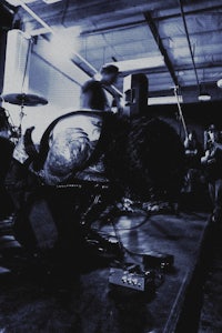 a group of people playing music in a dark room