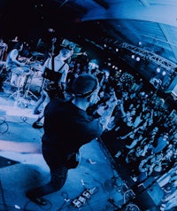 a group of people on stage at a concert