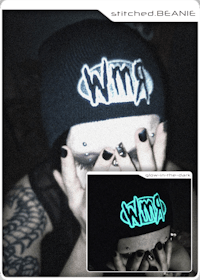 a woman wearing a beanie with the word wrm on it