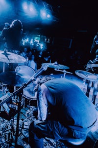 a group of people on stage at a concert