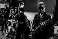 a black and white photo of a band playing music